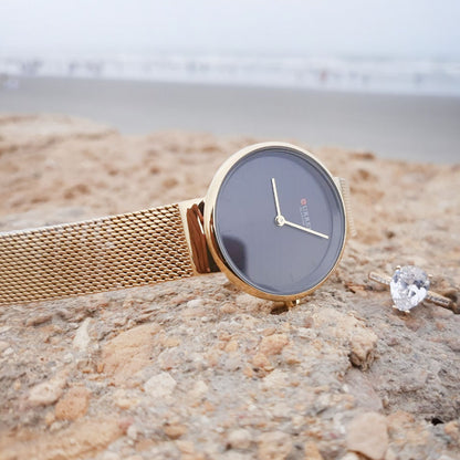 Golden Female Curren watch with an elegant ring